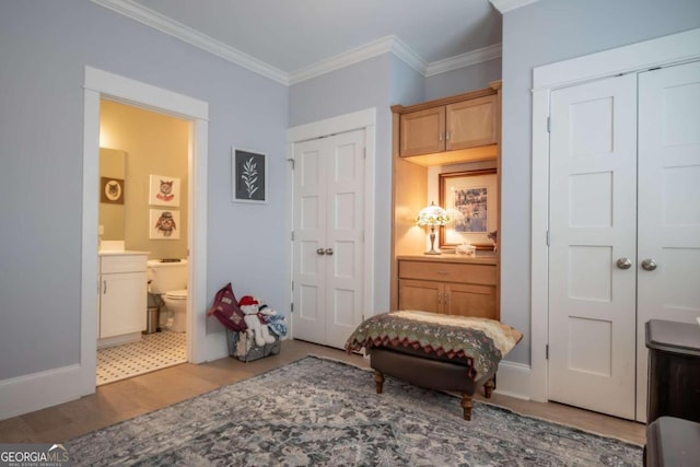 sitting room with crown molding and tile patterned floors