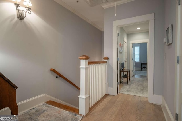 interior space with crown molding and hardwood / wood-style flooring