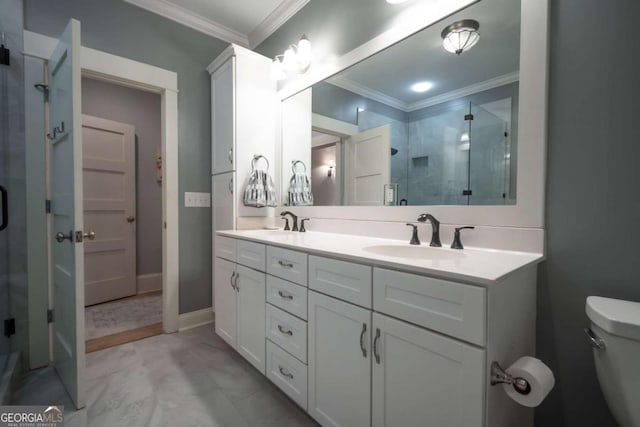 bathroom with vanity, toilet, ornamental molding, and an enclosed shower