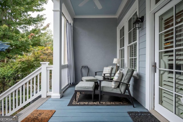 balcony featuring a porch and ceiling fan