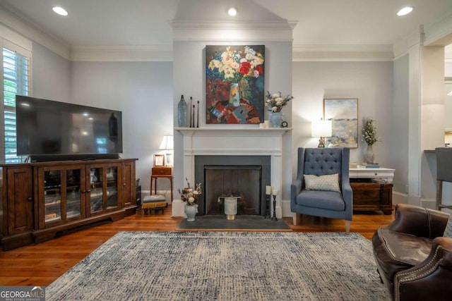 living room with ornamental molding and wood-type flooring