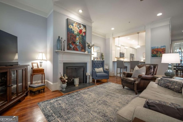 living room with crown molding and wood-type flooring