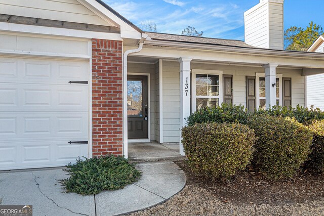 doorway to property with a porch