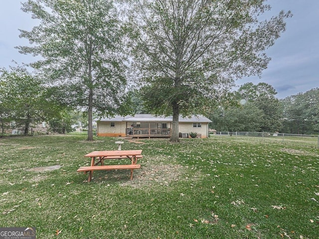 view of yard with a wooden deck