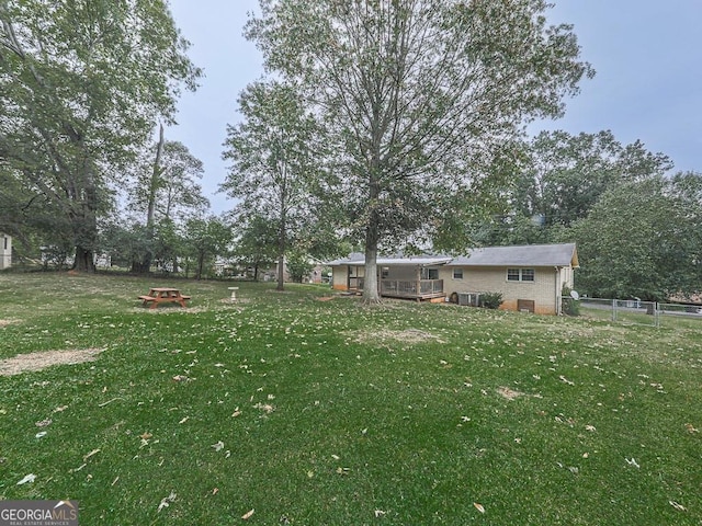 view of yard featuring a wooden deck