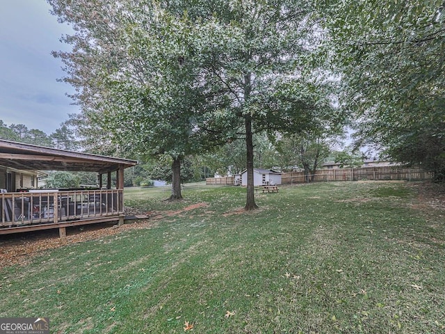 view of yard with a wooden deck