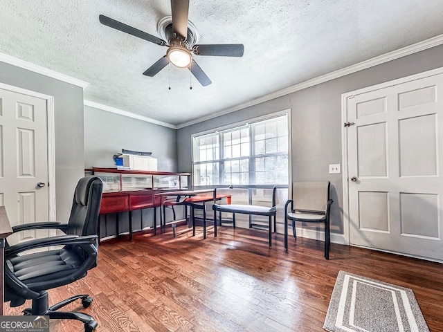 home office featuring a textured ceiling, ceiling fan, dark wood-type flooring, and crown molding