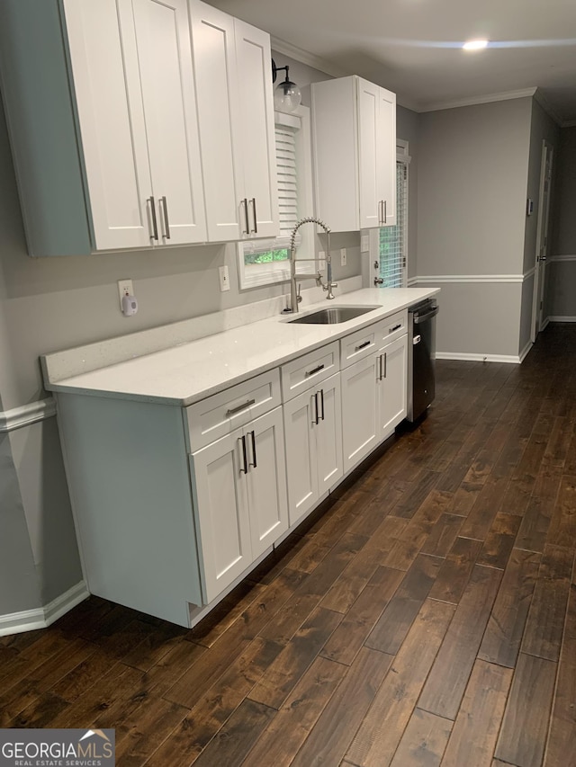 kitchen with white cabinets, crown molding, sink, and dark wood-type flooring