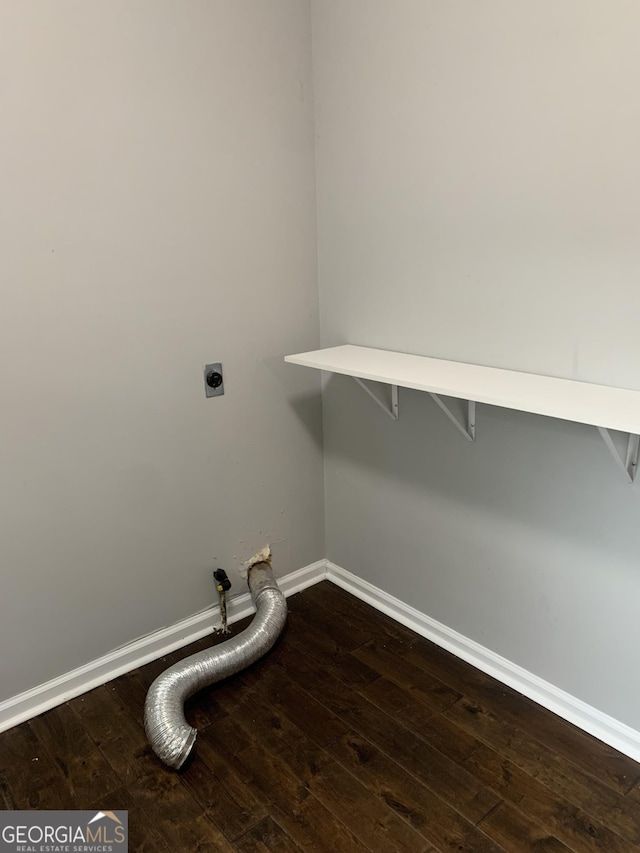 laundry room featuring electric dryer hookup, hookup for a gas dryer, and wood-type flooring