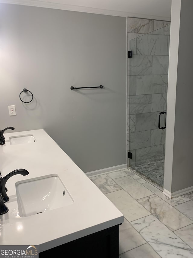 bathroom with vanity, an enclosed shower, and ornamental molding