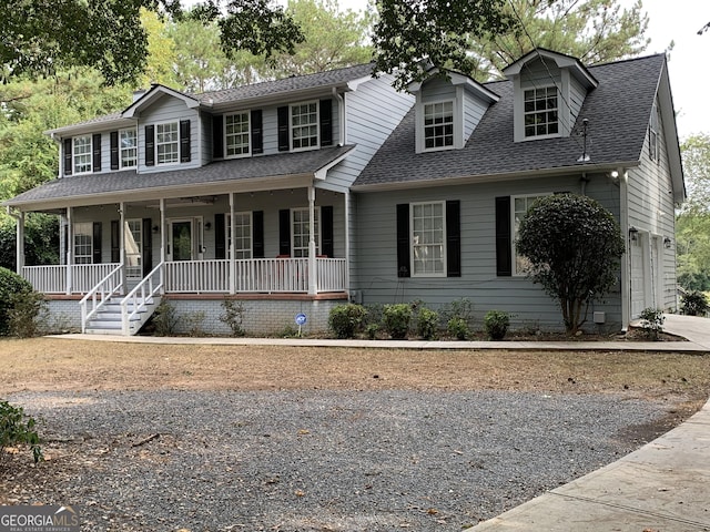 view of front of home featuring a porch and a garage