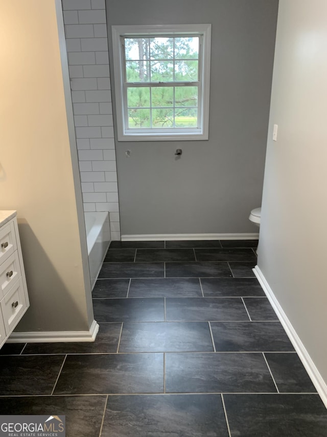 full bathroom featuring hardwood / wood-style flooring, vanity, toilet, and shower / bathing tub combination