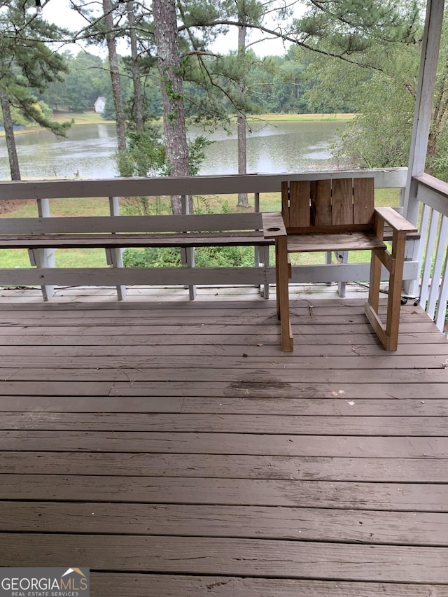 wooden deck with a water view