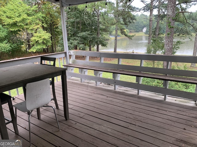 wooden deck with a water view