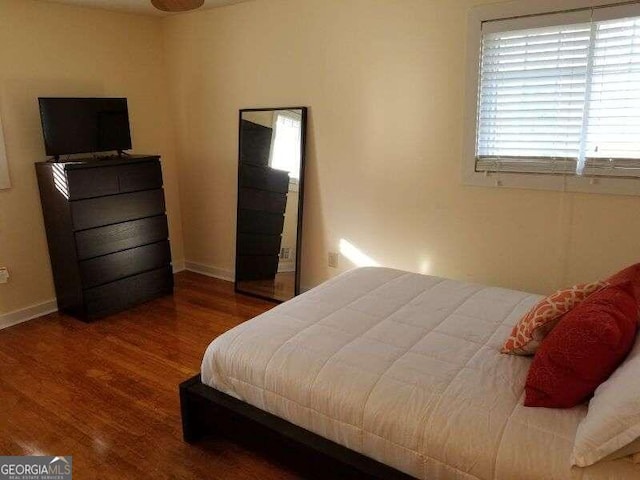 bedroom featuring wood-type flooring