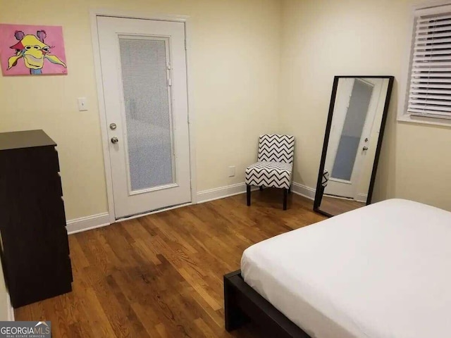 bedroom featuring dark wood-type flooring