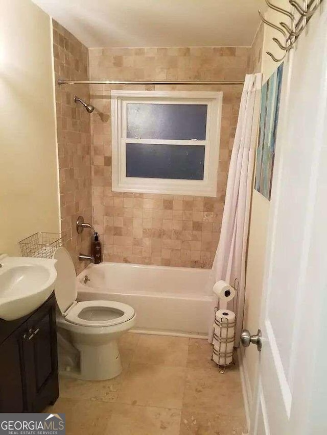 full bathroom featuring vanity, toilet, tile patterned floors, and shower / bathtub combination with curtain