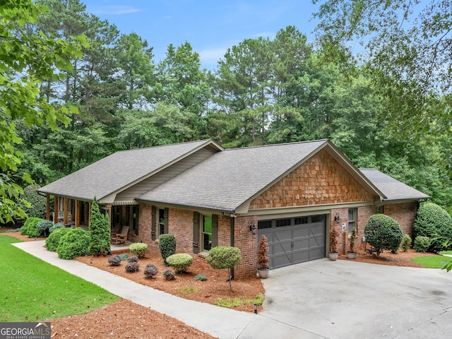 view of front of property with a porch and a garage