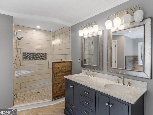 bathroom featuring a tile shower, parquet floors, crown molding, and vanity