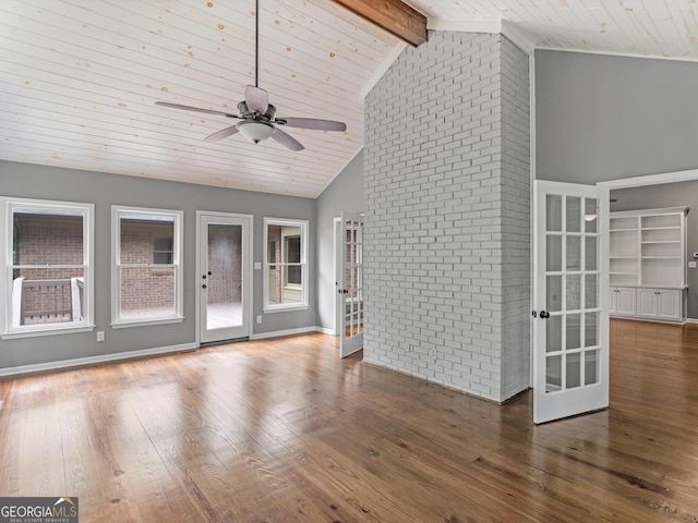 unfurnished living room with lofted ceiling with beams, ceiling fan, wood ceiling, and dark hardwood / wood-style floors