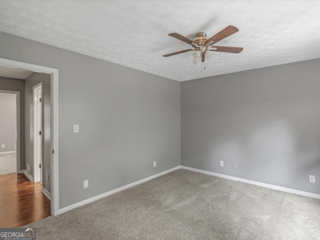 spare room with carpet flooring, a textured ceiling, and ceiling fan