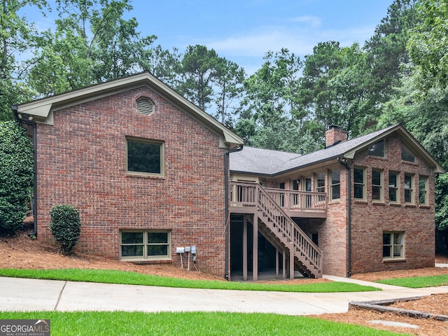 back of house featuring a wooden deck