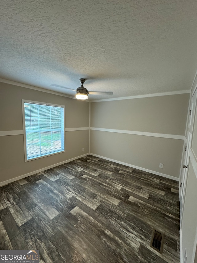 spare room with crown molding, dark hardwood / wood-style flooring, ceiling fan, and a textured ceiling