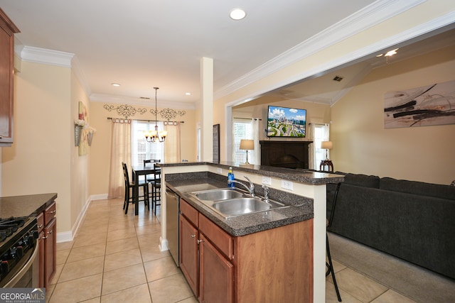 kitchen with sink, pendant lighting, crown molding, a center island with sink, and light tile patterned floors