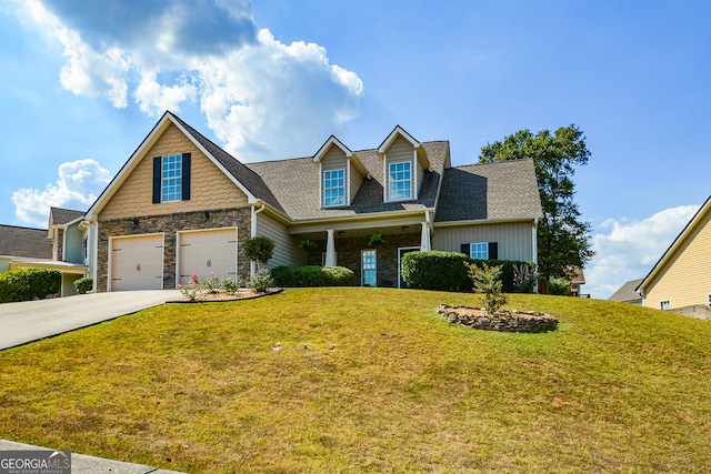 view of front of house with a front lawn and a garage