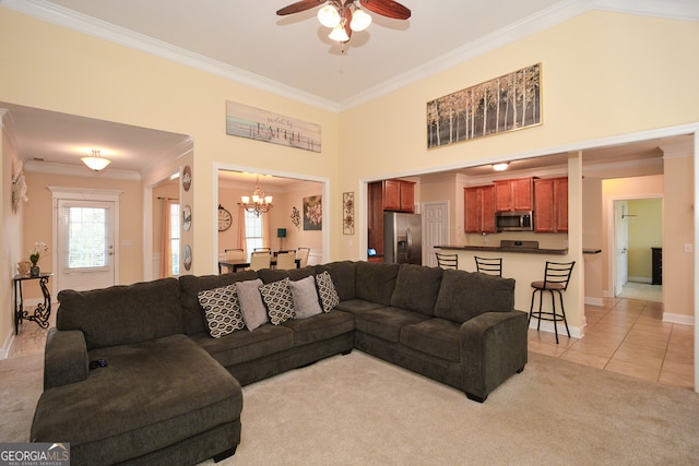 carpeted living room with ornamental molding and ceiling fan with notable chandelier