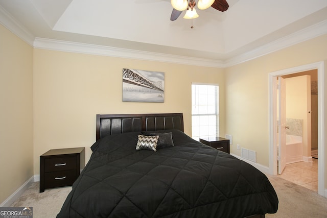 carpeted bedroom with ceiling fan, ensuite bathroom, and ornamental molding