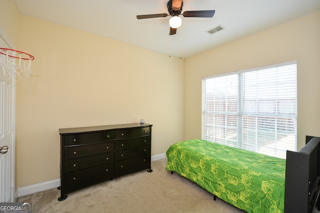 bedroom featuring ceiling fan and light colored carpet