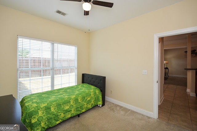 bedroom with ceiling fan and carpet flooring