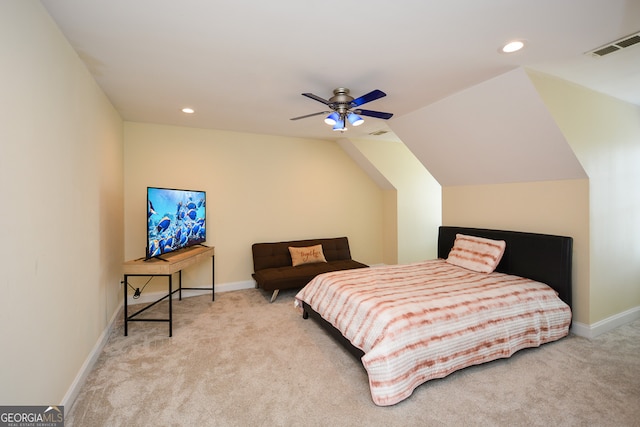 bedroom with ceiling fan, light carpet, and vaulted ceiling