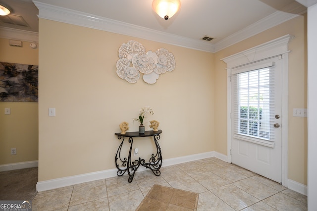 entryway featuring crown molding and light tile patterned floors