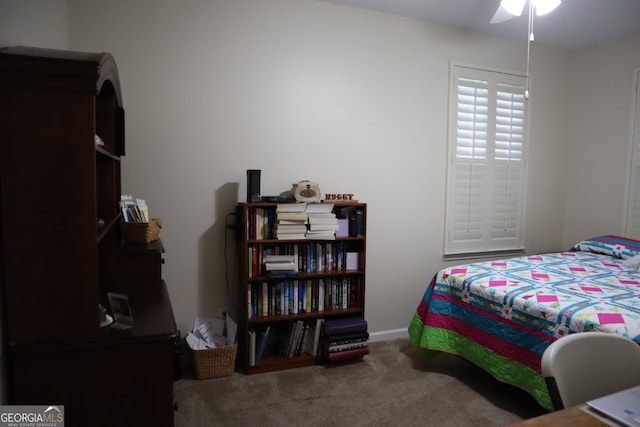 bedroom with ceiling fan and carpet