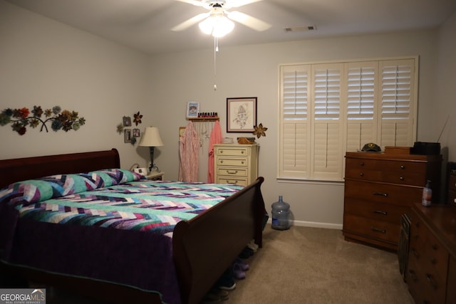 carpeted bedroom featuring ceiling fan