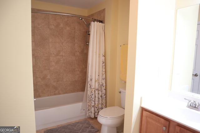 full bathroom featuring tile patterned flooring, vanity, toilet, and shower / tub combo with curtain