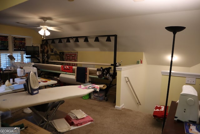 interior space featuring ceiling fan and carpet floors