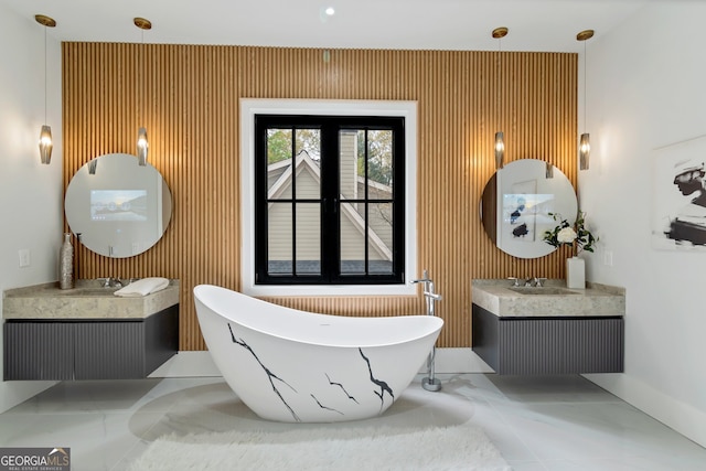 bathroom featuring vanity, wood walls, and a tub