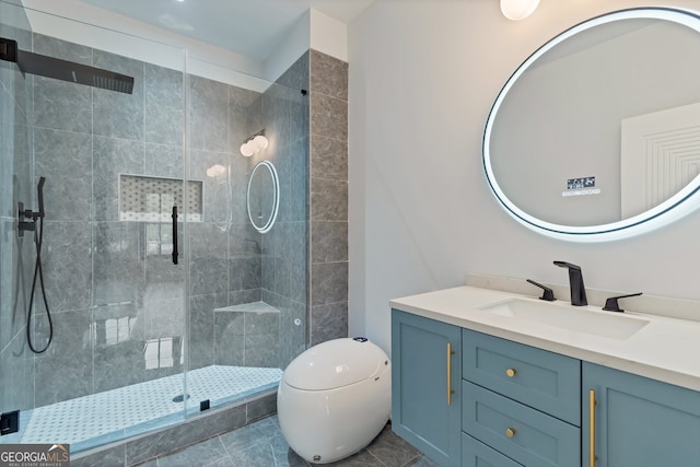 bathroom featuring tile patterned flooring, vanity, toilet, and walk in shower