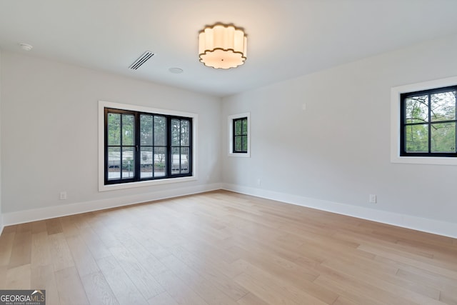 empty room with light hardwood / wood-style floors