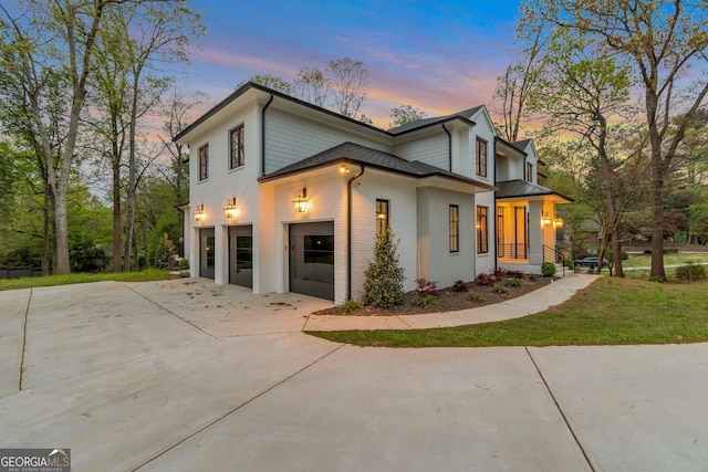 property exterior at dusk with a garage