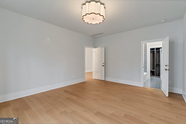 unfurnished room featuring light hardwood / wood-style floors