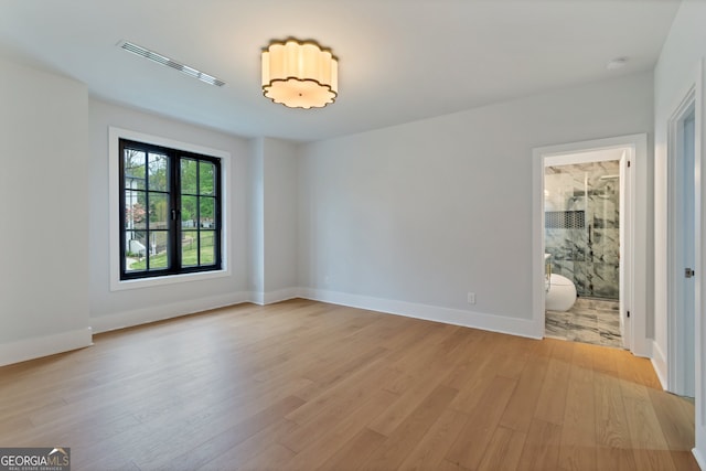 unfurnished room featuring light hardwood / wood-style flooring