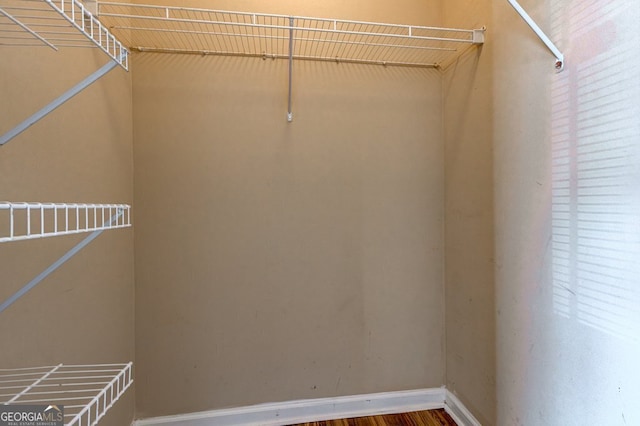 walk in closet featuring hardwood / wood-style flooring