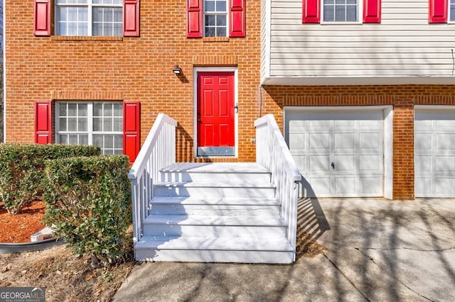 view of exterior entry with a garage