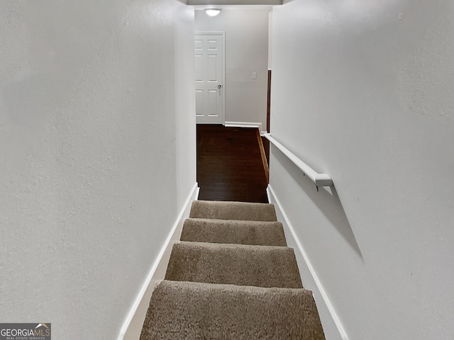 stairway with wood-type flooring