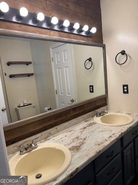 263 Hardin Rd SW, Plainville, GA 30733 - bathroom with double vanity, a sink, and toilet