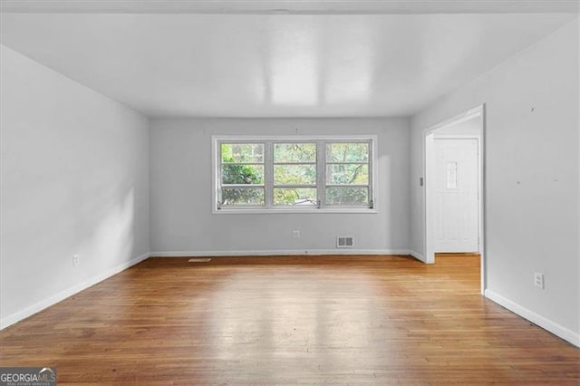 empty room with light wood-type flooring